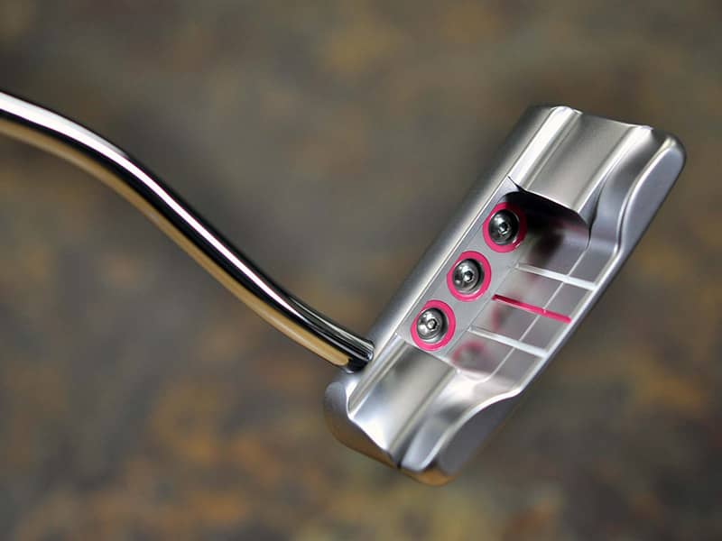 At first glance, she may bring to mind visions of Scotty's Tour-winning Studio Select Squareback putters, but in actuality she's a smooth-flanged widened Newport Button Back with several new features.